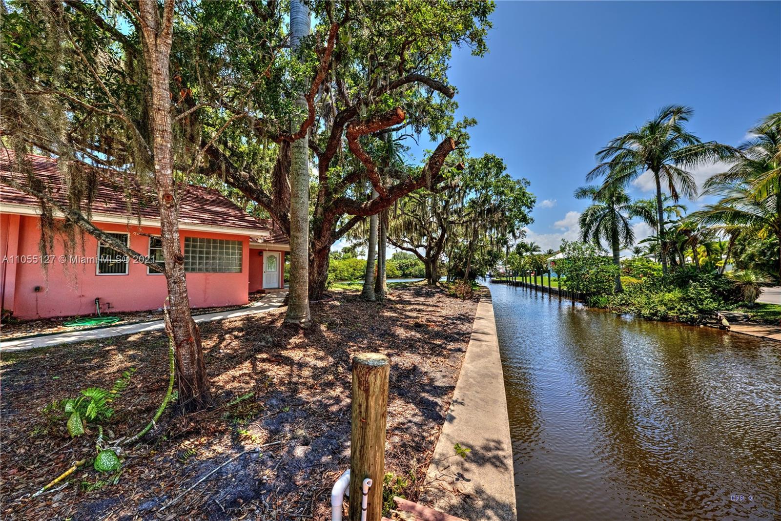 540 Southwest Salerno Road Stuart, FL 34997 - Photo 33 of 44 a view of a lake with a large tree