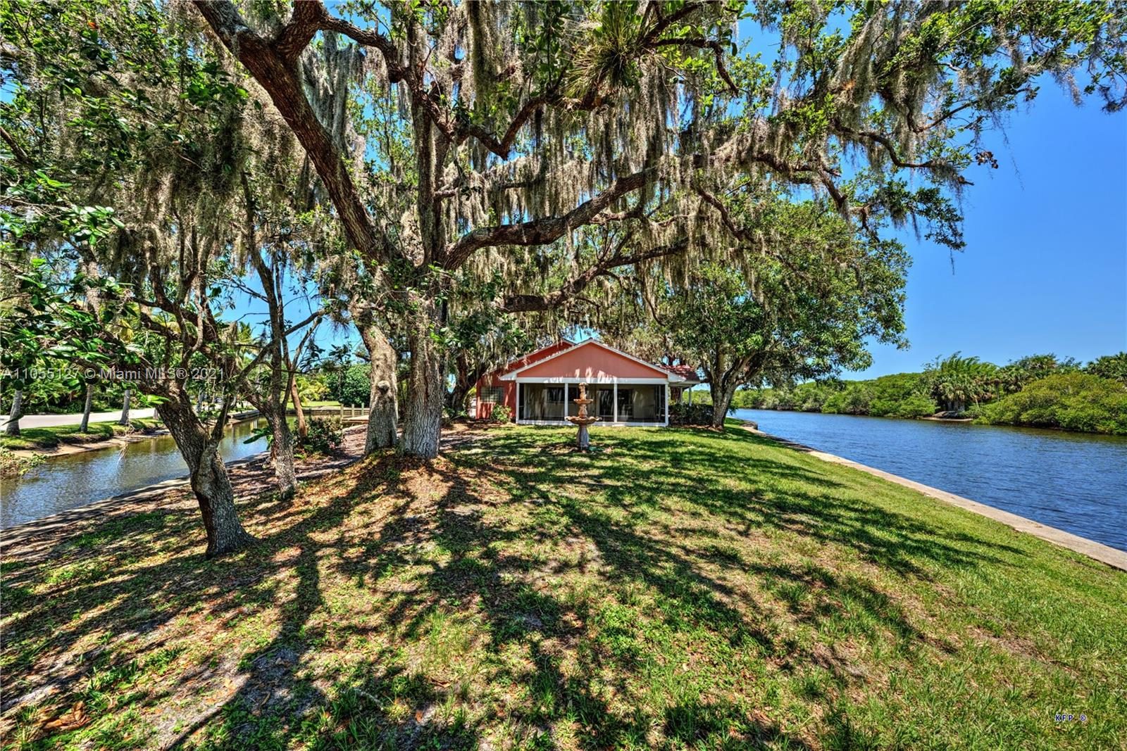 540 Southwest Salerno Road Stuart, FL 34997 - Photo 36 of 44 a view of a large garden with large trees