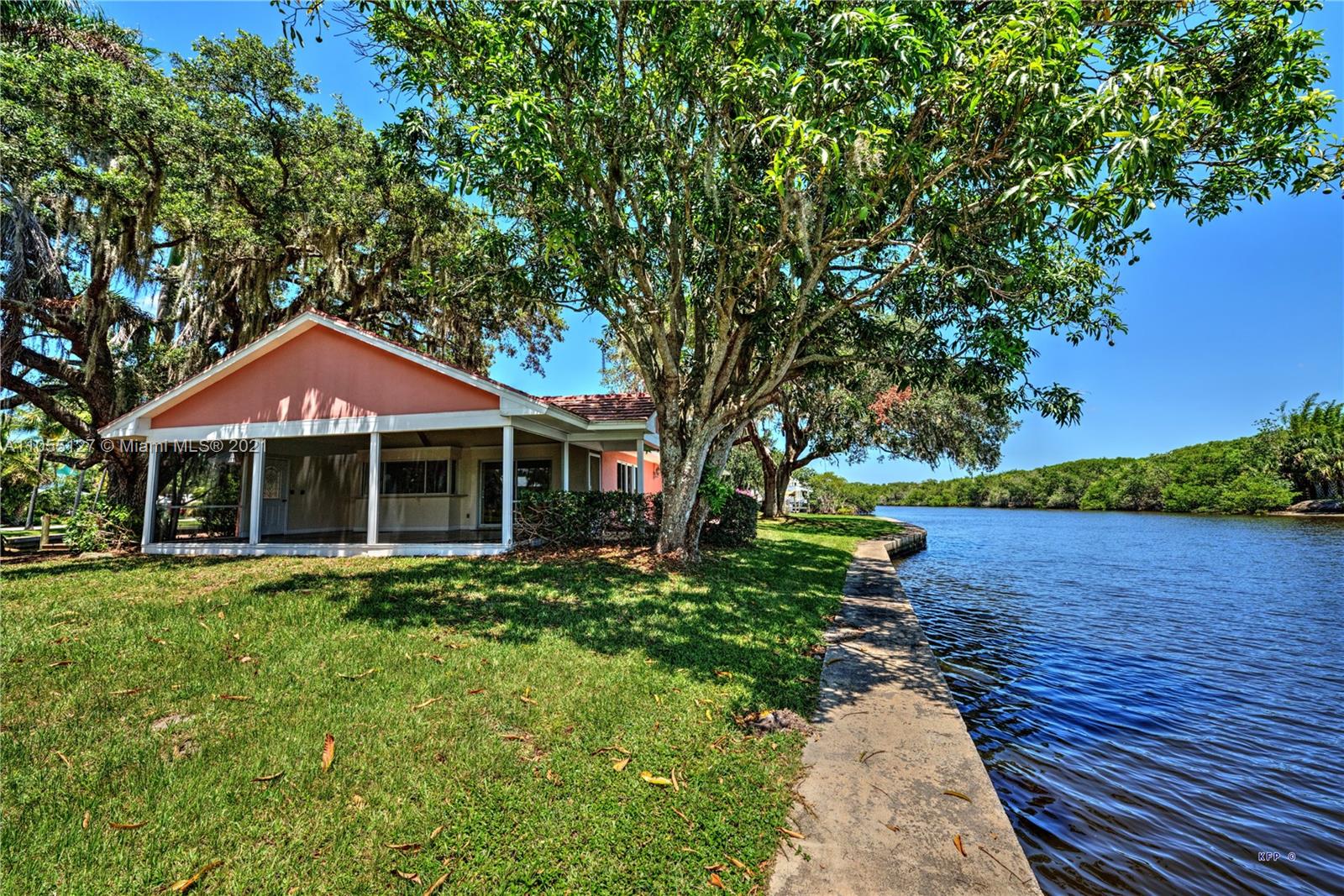 540 Southwest Salerno Road Stuart, FL 34997 - Photo 38 of 44 a front view of a house with a yard