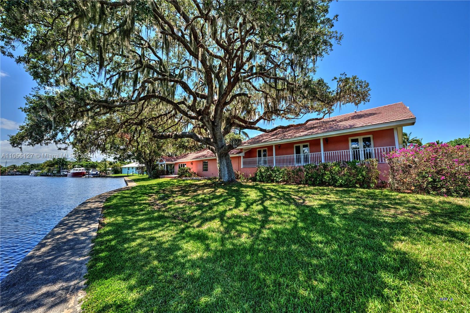 540 Southwest Salerno Road Stuart, FL 34997 - Photo 42 of 44 a front view of a house with garden