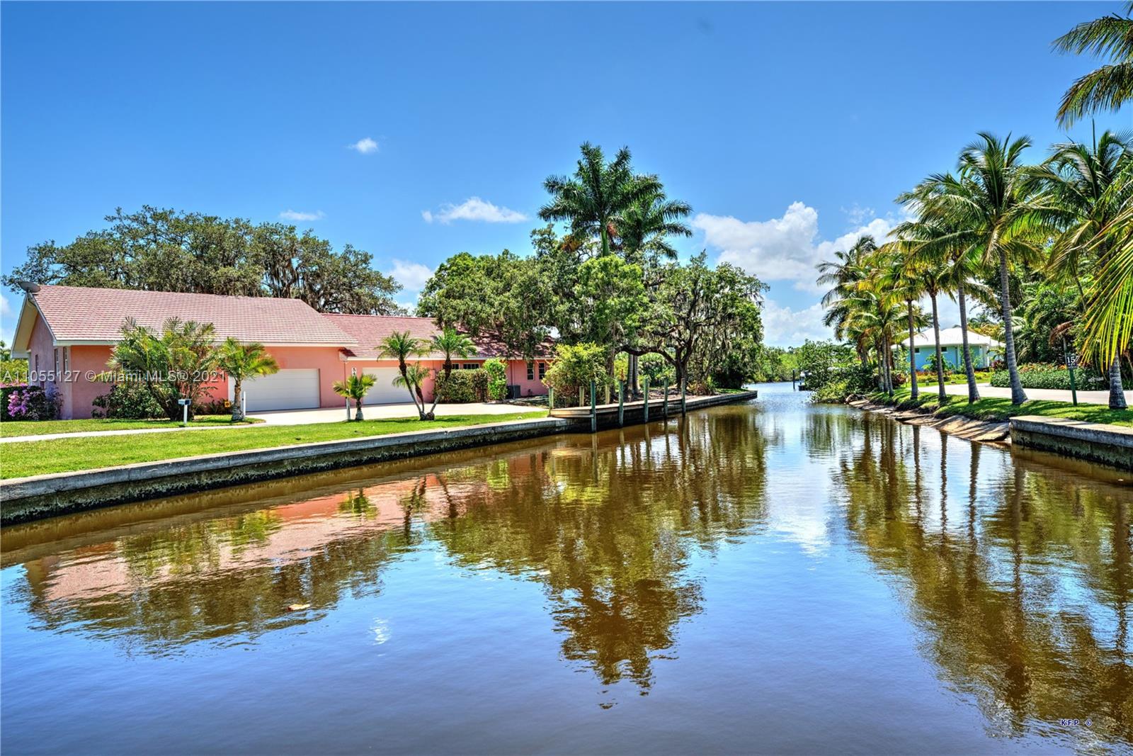 540 Southwest Salerno Road Stuart, FL 34997 - Photo 43 of 44 a view of a lake with a house in the background
