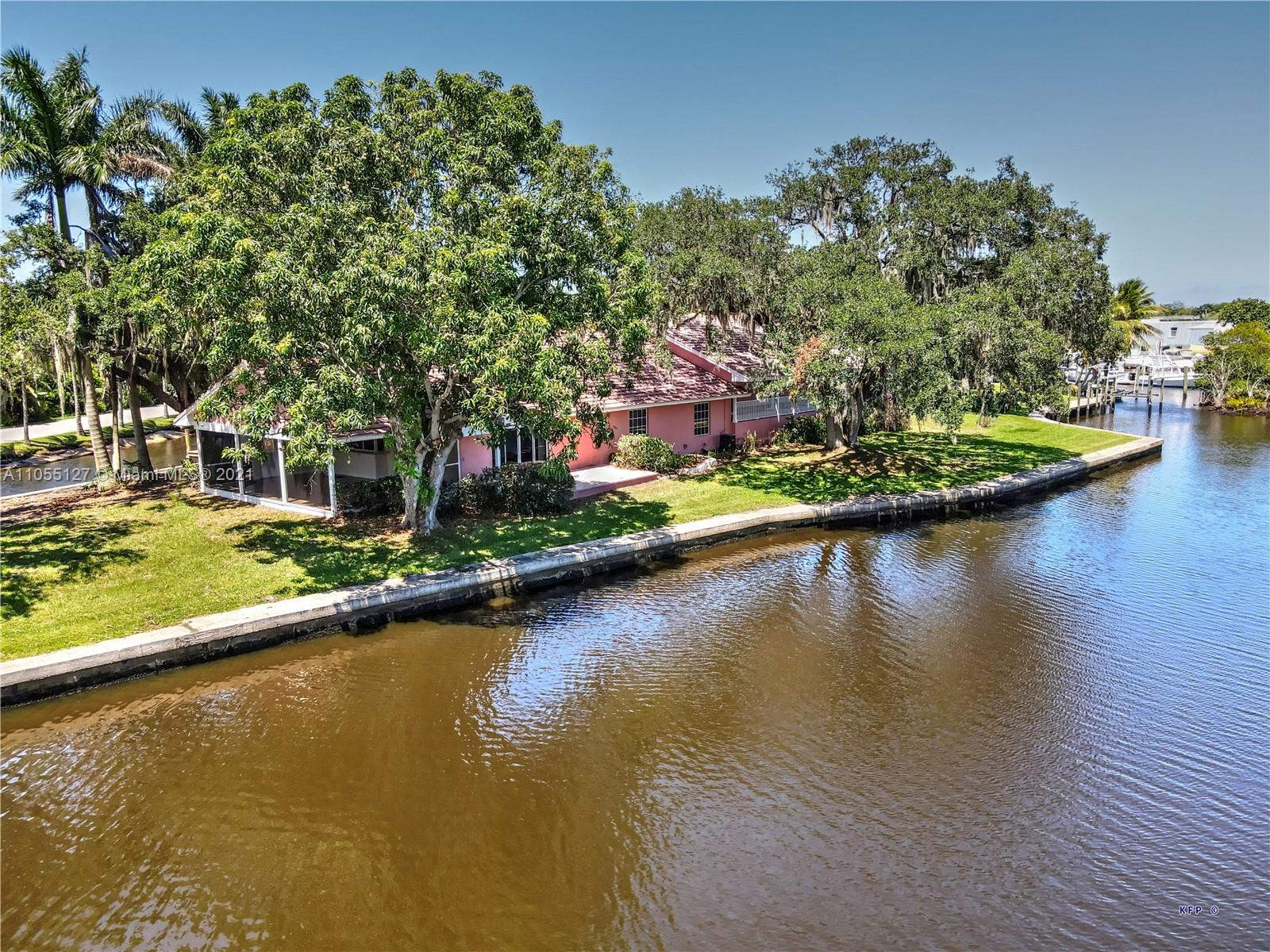 540 Southwest Salerno Road Stuart, FL 34997 - Photo 5 of 44 an aerial view of a house with swimming pool and outdoor space