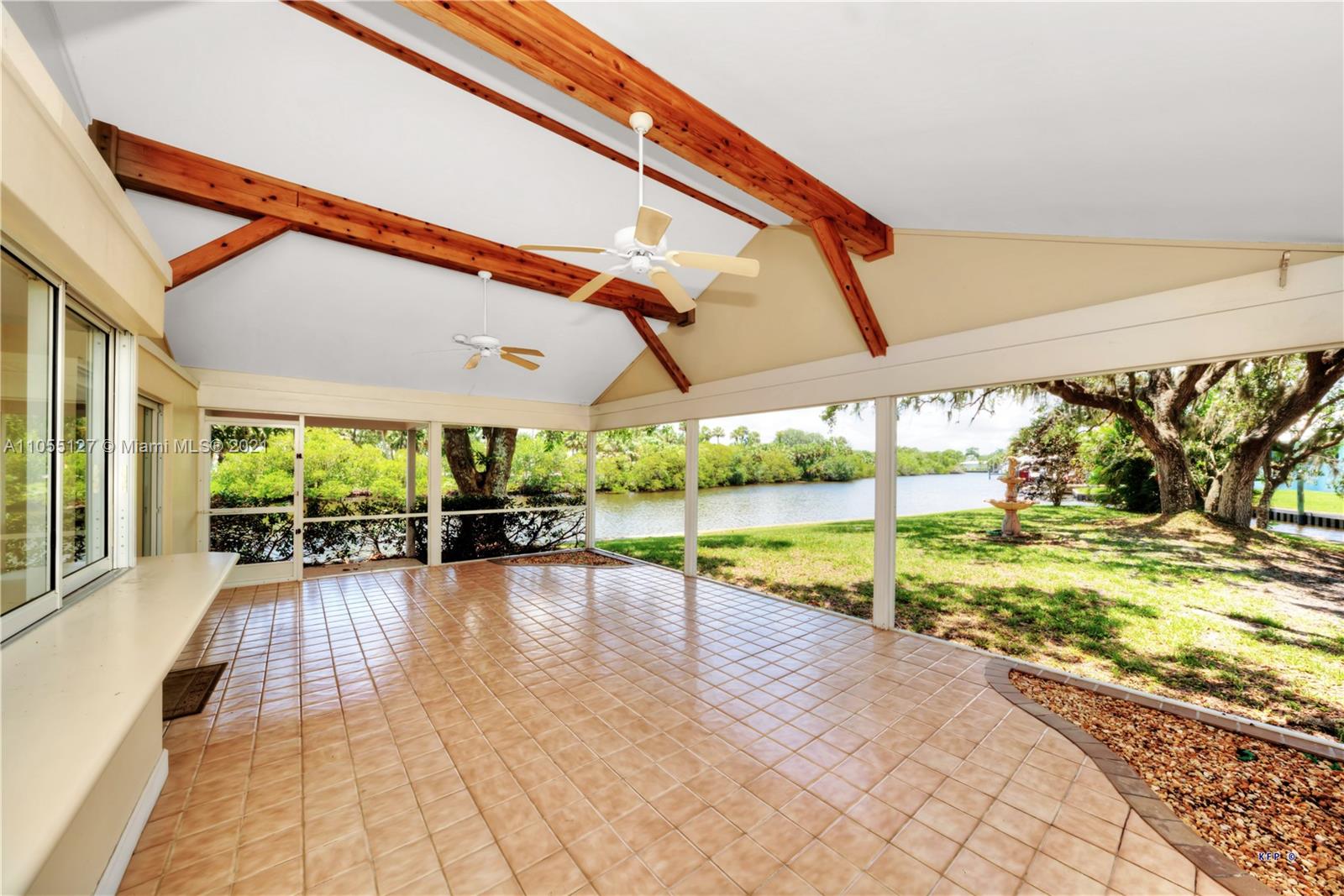 540 Southwest Salerno Road Stuart, FL 34997 - Photo 6 of 44 a view of swimming pool with a patio and a yard