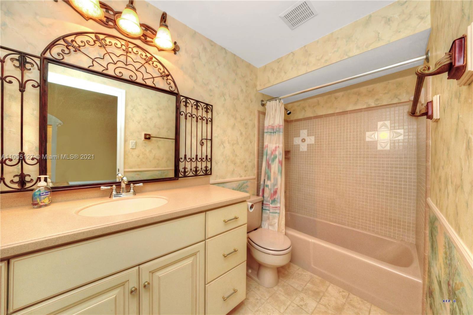 540 Southwest Salerno Road Stuart, FL 34997 - Photo 10 of 44 a bathroom with a granite countertop sink toilet and shower
