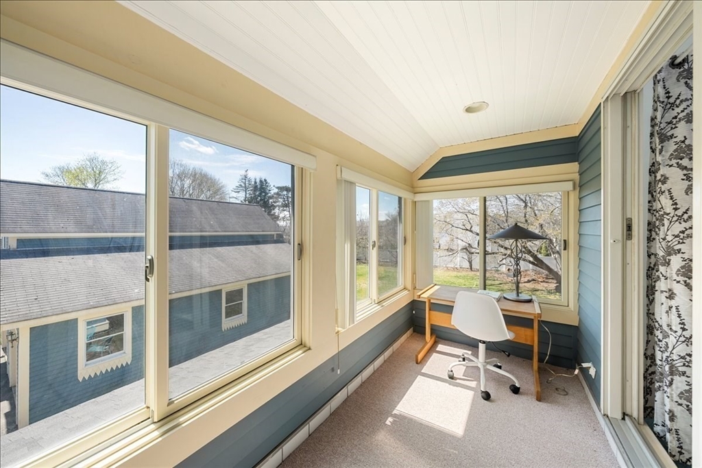 10 2nd Street Natick, MA 01760 - Photo 18 of 31 a living room with furniture and a floor to ceiling window