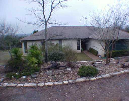 8900 Feather Hill Road Austin, TX 78737 - Photo 1 of 1 a view of a house with a yard