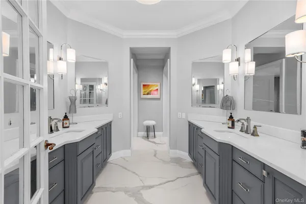 a bedroom with furniture and a large mirror