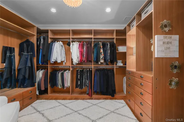 a bedroom with a large bed and a large window