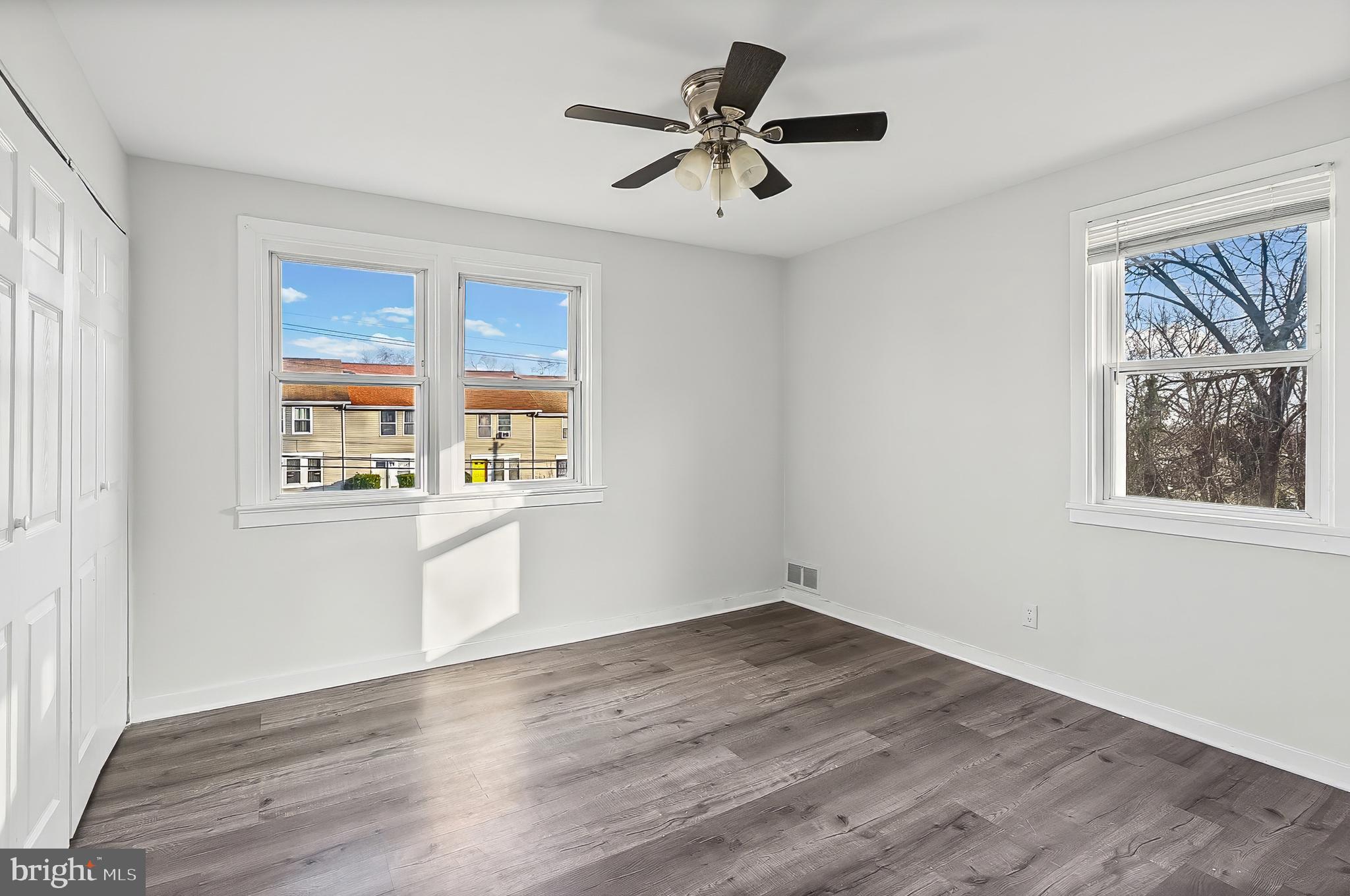 30 North Athol Avenue Baltimore, MD 21229 - Photo 9 of 20 a view of an empty room with a window and wooden floor