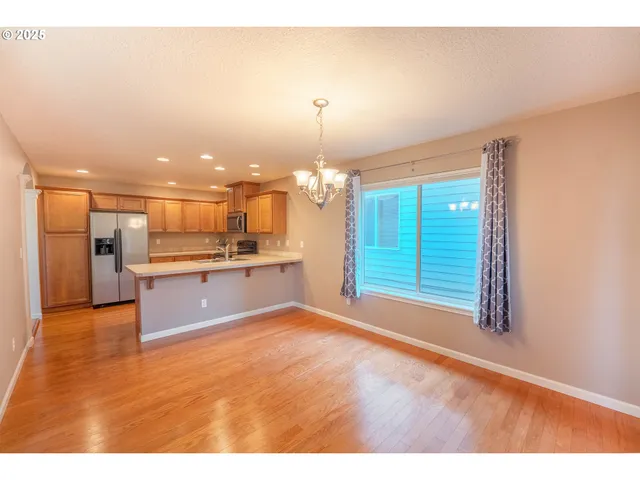 a view of a kitchen with a sink