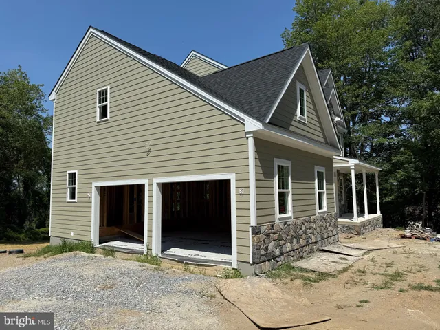 a view of a white house with a large windows