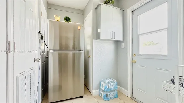 a view of kitchen with furniture and wooden floor