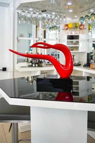 a kitchen with stainless steel appliances kitchen island granite countertop a stove and a cabinets