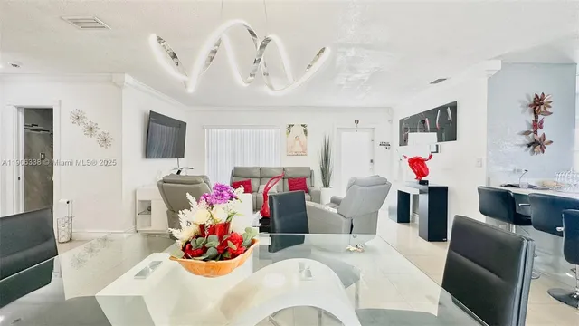 a living room with furniture and flat screen tv