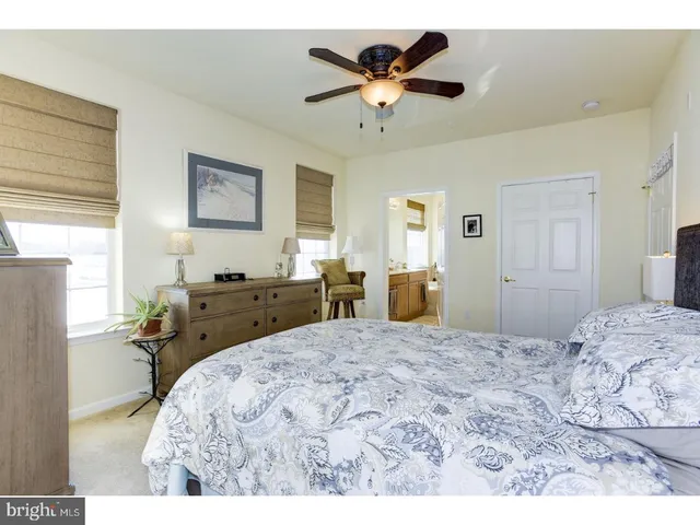 a bed room with a bed and a chandelier