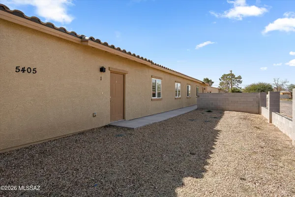 a view of a backyard of a house