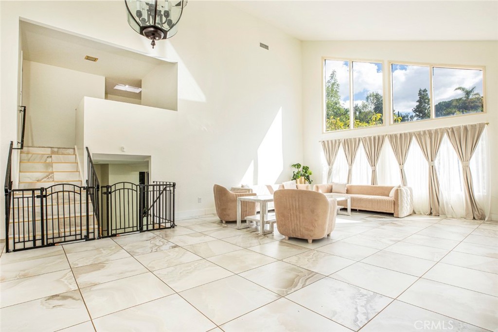 18810 Kirkcolm Lane Porter Ranch, CA 91326 - Photo 23 of 75 a living room with a couch and a table