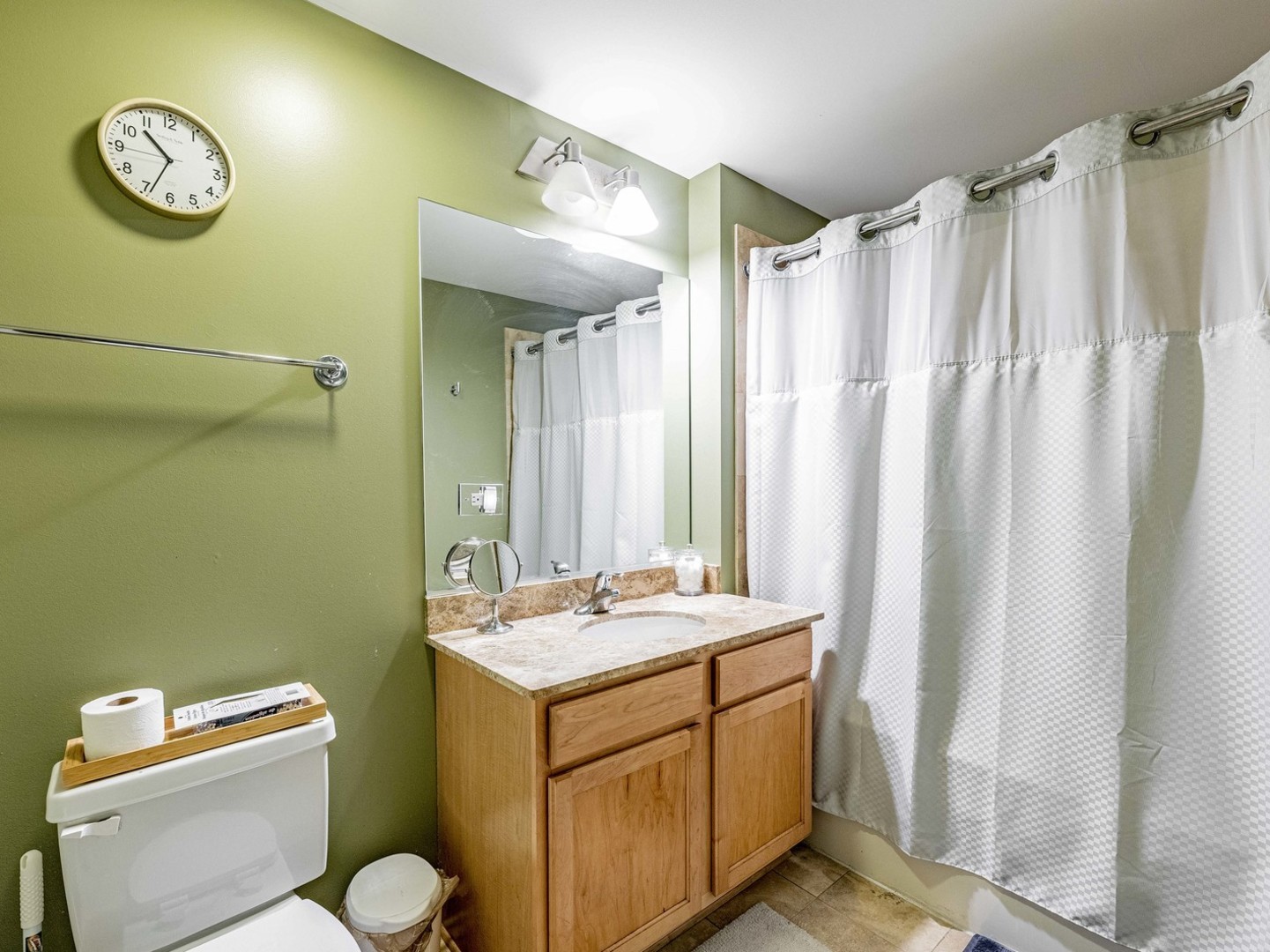 909 West Washington Boulevard, Unit 911 Chicago, IL 60607 - Photo 11 of 26 a bathroom with a sink a toilet and a mirror