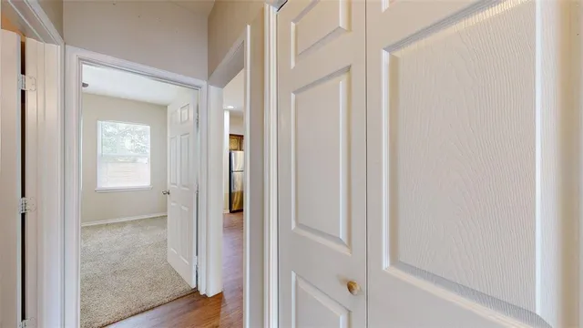 a view of a bathroom from a hallway