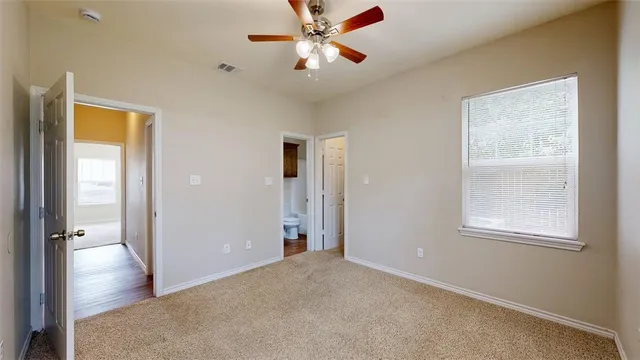 a white toilet sitting next to a bathroom sink