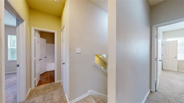 a view of a livingroom from a hallway