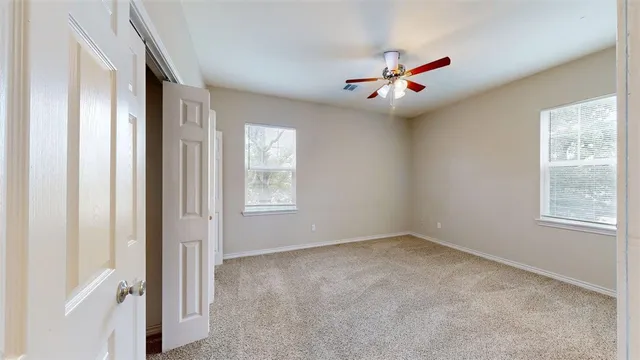 a view of a livingroom with a ceiling fan