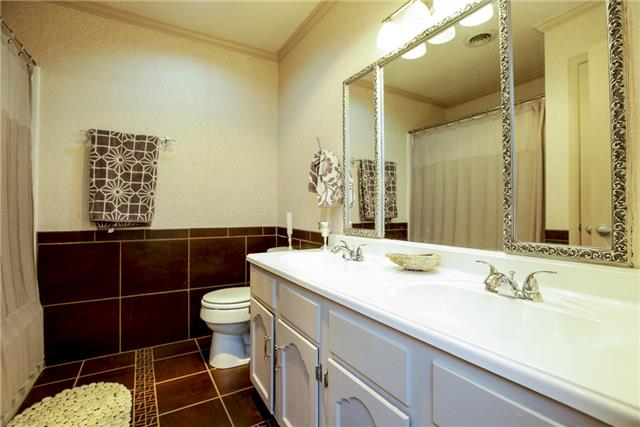 215 Lawrence Lane Springfield, TN 37172 - Photo 11 of 20 a bathroom with a sink vanity mirror and toilet