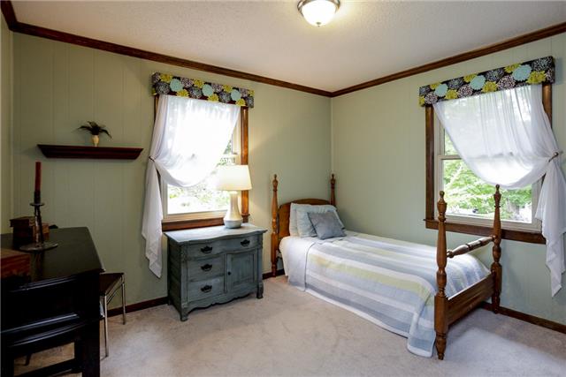215 Lawrence Lane Springfield, TN 37172 - Photo 13 of 20 a bedroom with a bed and a window
