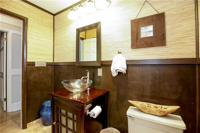 215 Lawrence Lane Springfield, TN 37172 - Photo 14 of 20 a bathroom with a sink mirror and toilet