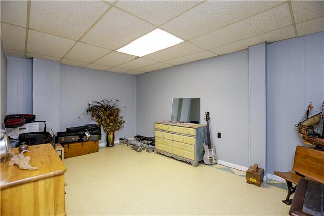 215 Lawrence Lane Springfield, TN 37172 - Photo 16 of 20 a room with gym equipment and a table