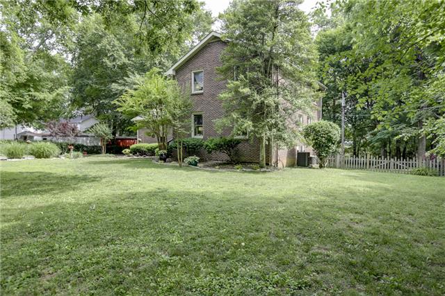 215 Lawrence Lane Springfield, TN 37172 - Photo 19 of 20 a view of a backyard with large trees