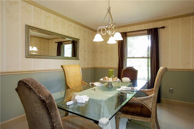 215 Lawrence Lane Springfield, TN 37172 - Photo 3 of 20 a view of a dining room with furniture a chandelier and a window