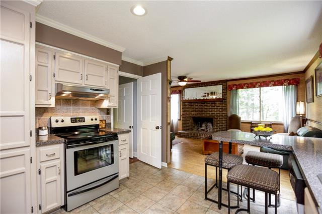 215 Lawrence Lane Springfield, TN 37172 - Photo 4 of 20 a kitchen with stainless steel appliances a stove a sink and a refrigerator