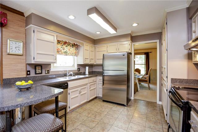 215 Lawrence Lane Springfield, TN 37172 - Photo 5 of 20 a kitchen with furniture wooden floor and stainless steel appliances