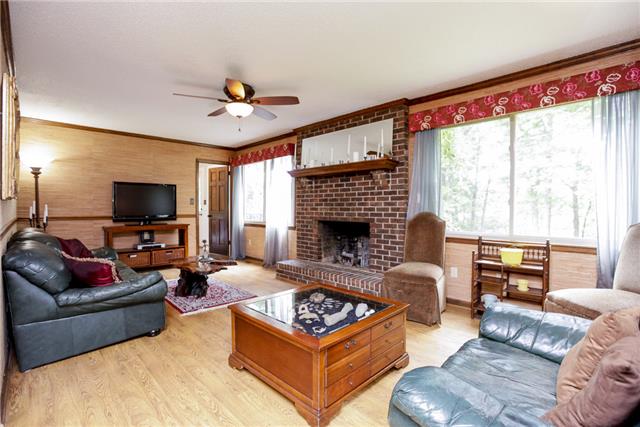 215 Lawrence Lane Springfield, TN 37172 - Photo 7 of 20 a living room with furniture a flat screen tv and a large window
