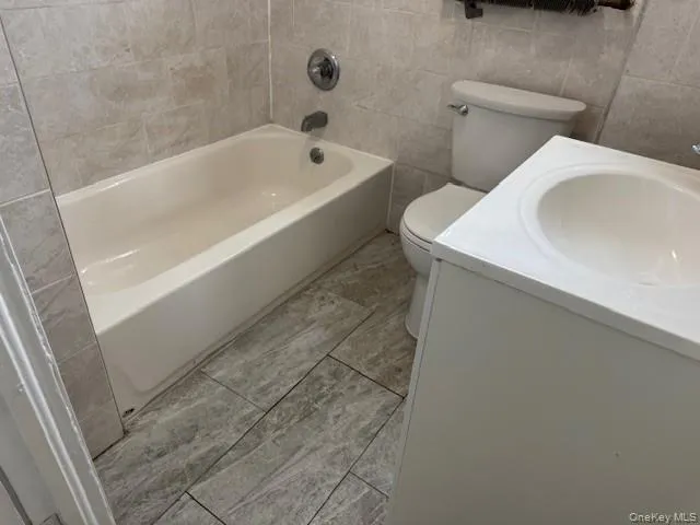 a bathroom with a sink and toilet