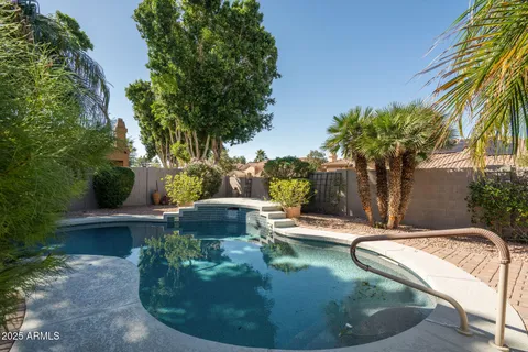 a view of a swimming pool with sitting area