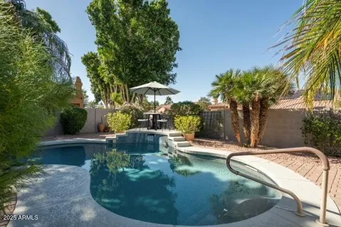 a view of a swimming pool with a patio