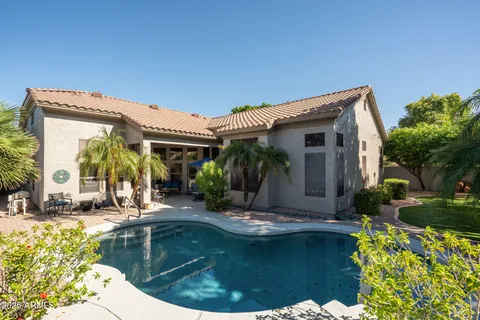 a view of swimming pool with outdoor seating