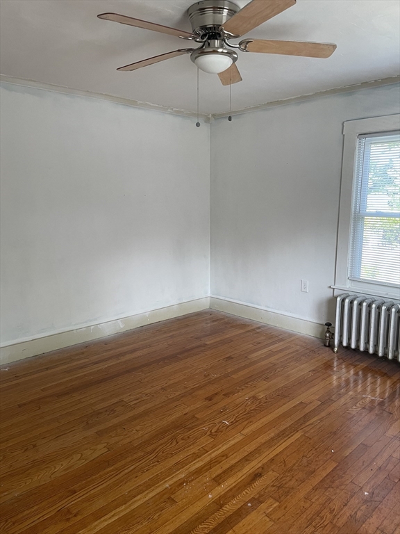 245 Arthur Street Springfield, MA 01104 - Photo 15 of 20 a view of an empty room with wooden floor and a window