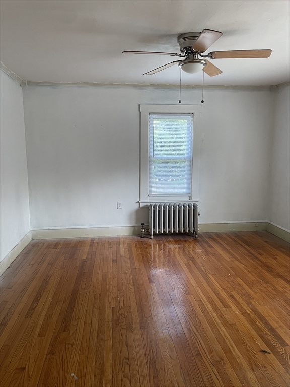 245 Arthur Street Springfield, MA 01104 - Photo 16 of 20 wooden floor in an empty room with a window