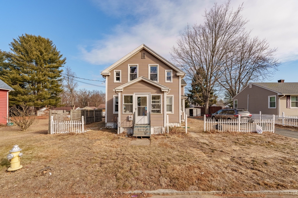 245 Arthur Street Springfield, MA 01104 - Photo 2 of 20 a view of a house with a yard covered in snow