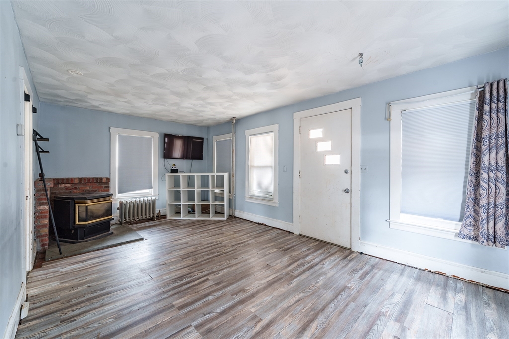 245 Arthur Street Springfield, MA 01104 - Photo 7 of 20 a view of a livingroom with furniture and wooden floor