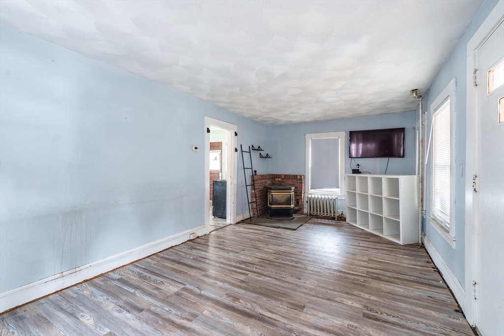 245 Arthur Street Springfield, MA 01104 - Photo 8 of 20 a view of a livingroom with furniture and an empty room