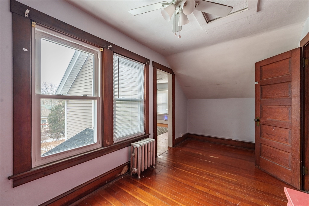 245 Arthur Street Springfield, MA 01104 - Photo 10 of 20 a view of empty room with wooden floor and fan