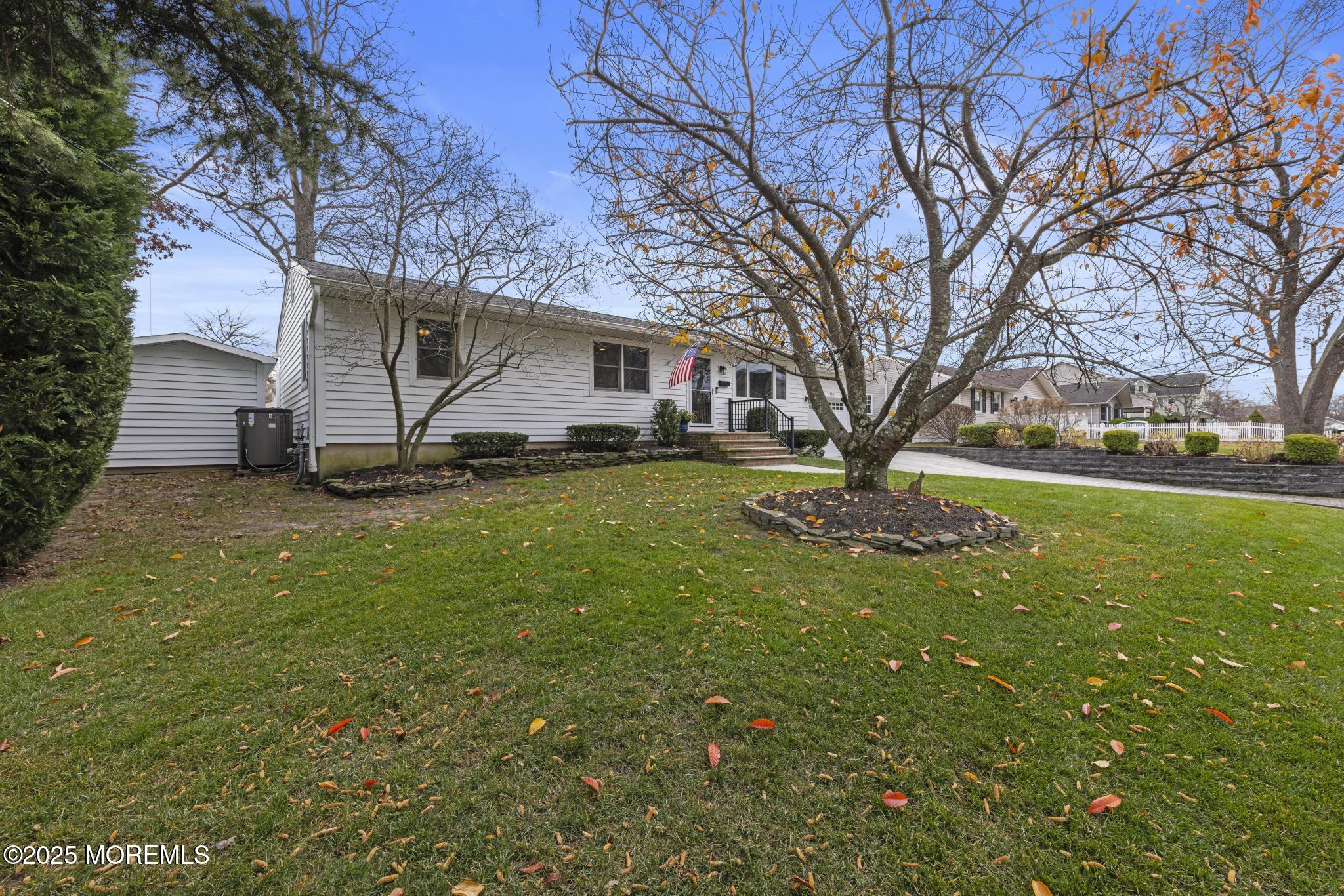 1704 Grove Street Wall, NJ 07719 - Photo 2 of 53 a view of a yard with a tree