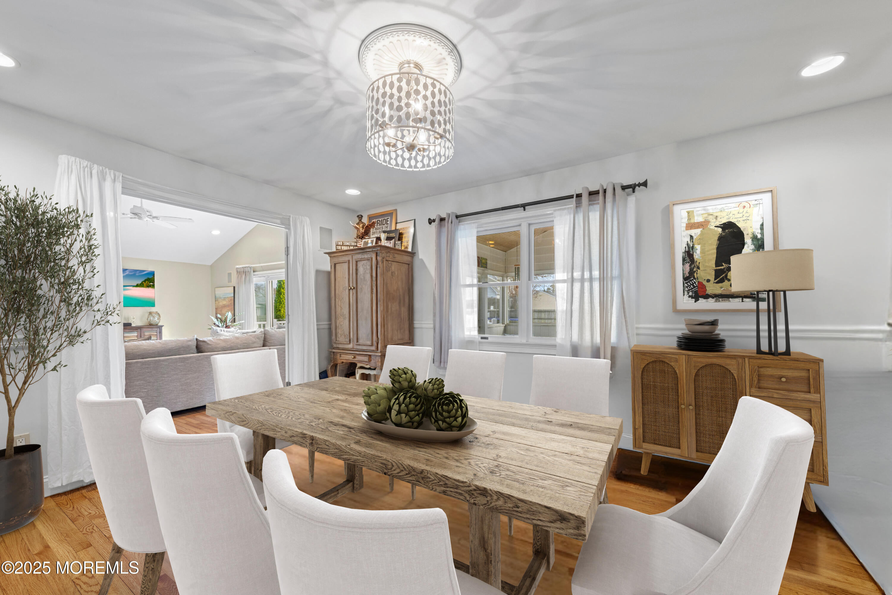 1704 Grove Street Wall, NJ 07719 - Photo 22 of 53 a dining room with furniture a window and wooden floor