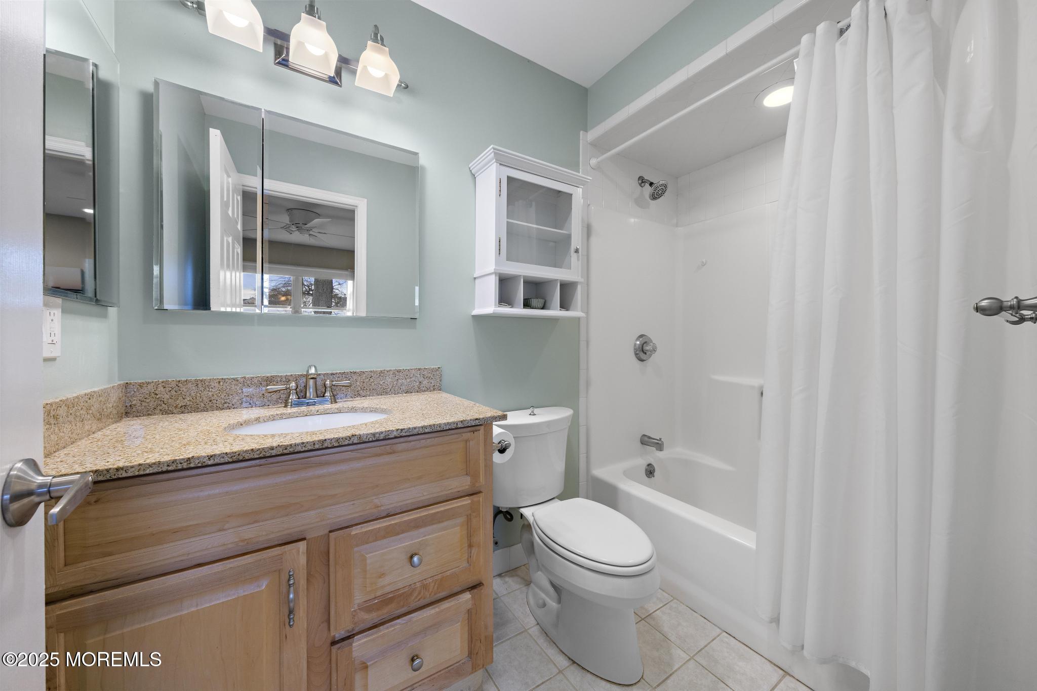 1704 Grove Street Wall, NJ 07719 - Photo 26 of 53 a bathroom with a granite countertop sink toilet a large mirror a vanity and shower