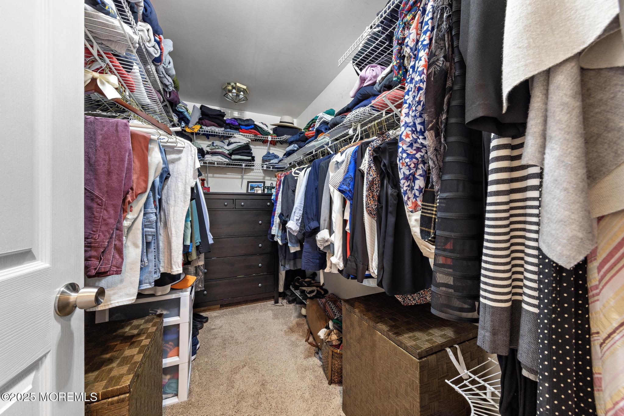 1704 Grove Street Wall, NJ 07719 - Photo 27 of 53 a view of walk in closet with clothes