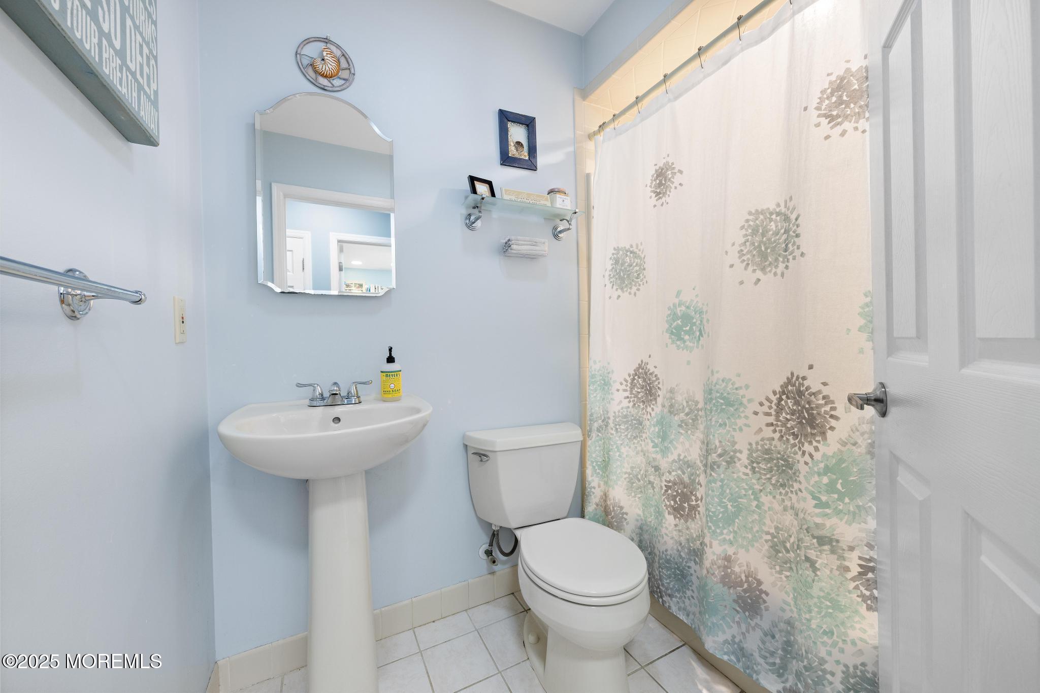 1704 Grove Street Wall, NJ 07719 - Photo 30 of 53 a bathroom with a sink toilet and shower